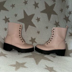 Stylish pink leather boots featuring a chunky black sole